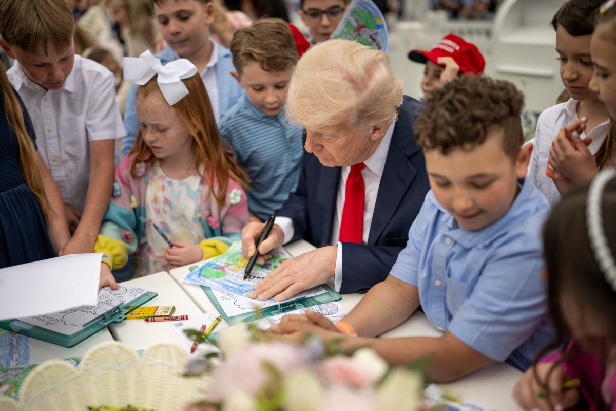 President Donald Trump colors with children at the White House Easter Egg Roll, Monday, April 21, 2025, on the South Lawn. (Official White House Photo by Daniel Torok)