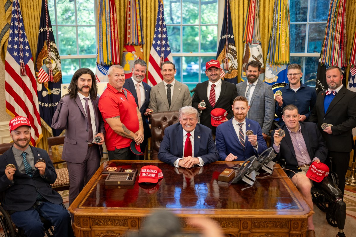 President Donald Trump signs executive orders alongside Secretary of Education Linda McMahon and wounded warriors in the Oval Office, Wednesday, April 23, 2025. (Official White House Photo by Daniel Torok)