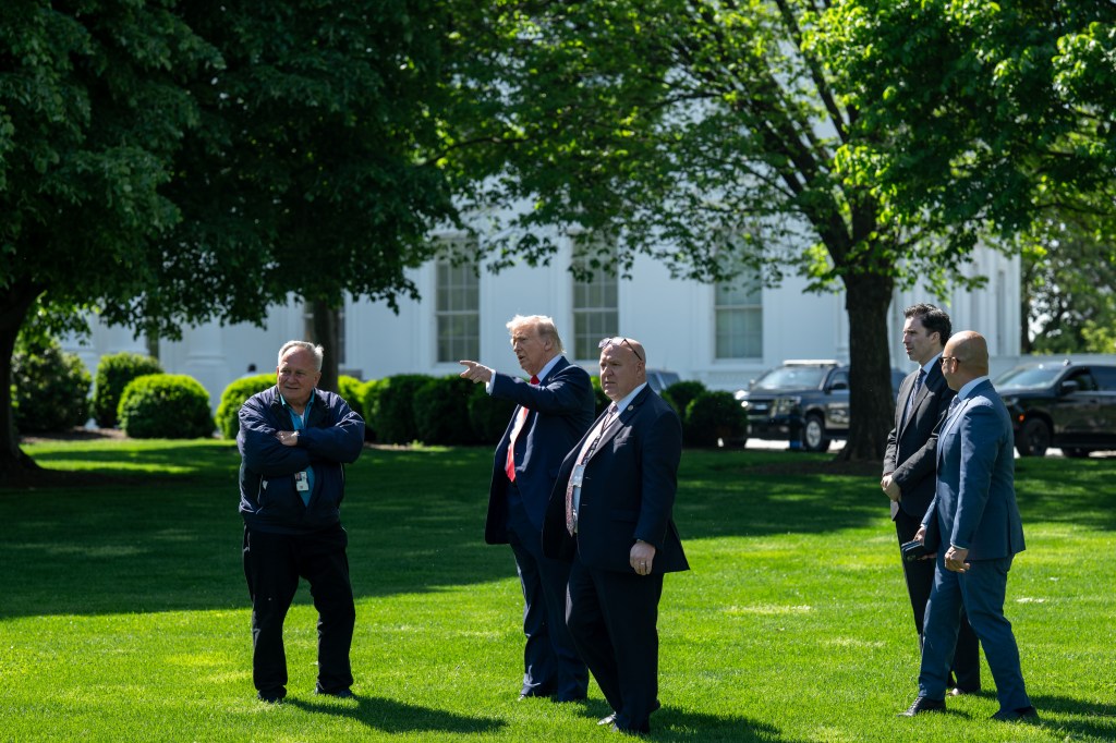 President Donald Trump surveys the North and South Lawns of the White House for potential locations for new flag poles, Wednesday, April 23, 2025. (Official White House Photo by Joyce N. Boghosian)