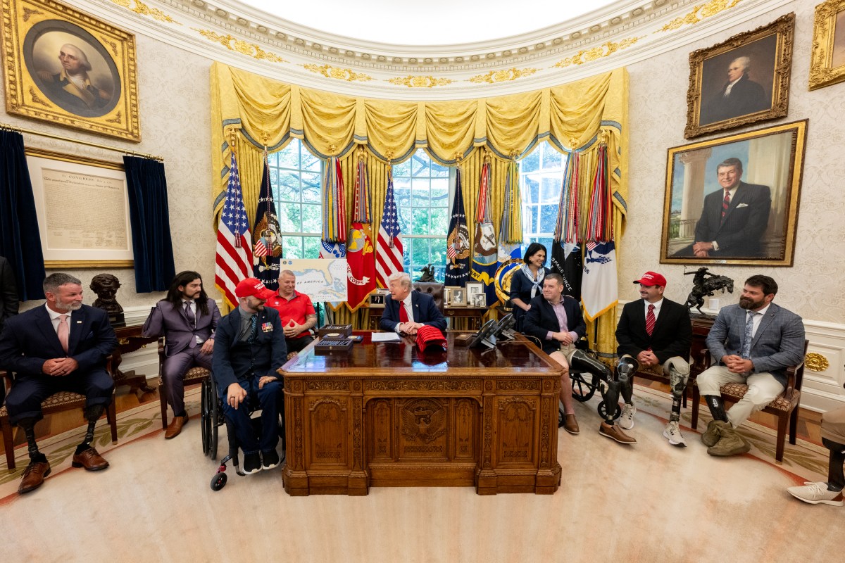 President Donald Trump signs executive orders alongside Secretary of Education Linda McMahon and wounded warriors in the Oval Office, Wednesday, April 23, 2025. (Official White House Photo by Molly Riley)