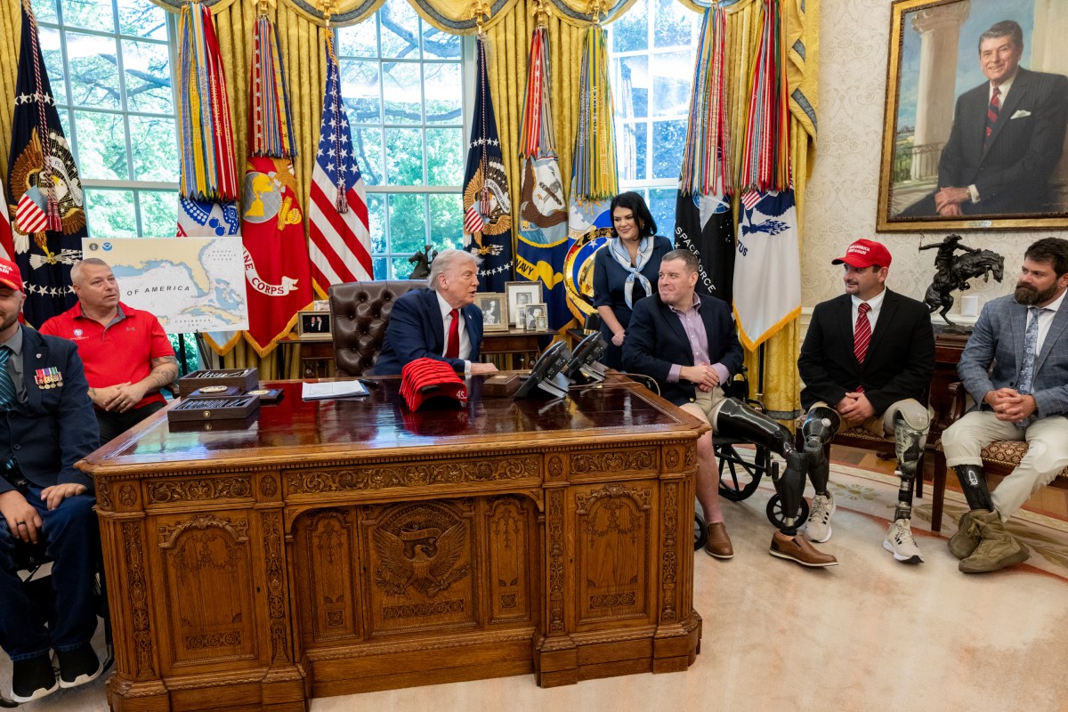 President Donald Trump signs executive orders alongside Secretary of Education Linda McMahon and wounded warriors in the Oval Office, Wednesday, April 23, 2025. (Official White House Photo by Molly Riley)