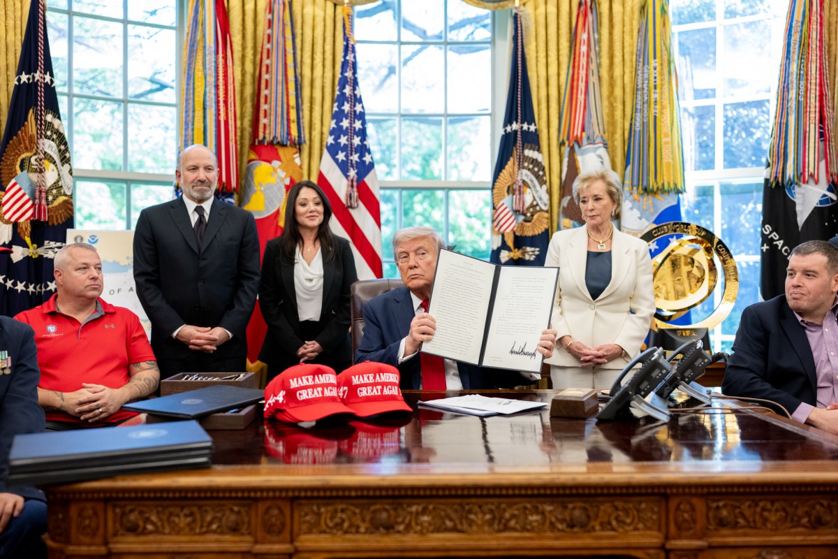 President Donald Trump signs executive orders alongside Secretary of Education Linda McMahon and wounded warriors in the Oval Office, Wednesday, April 23, 2025. (Official White House Photo by Molly Riley)