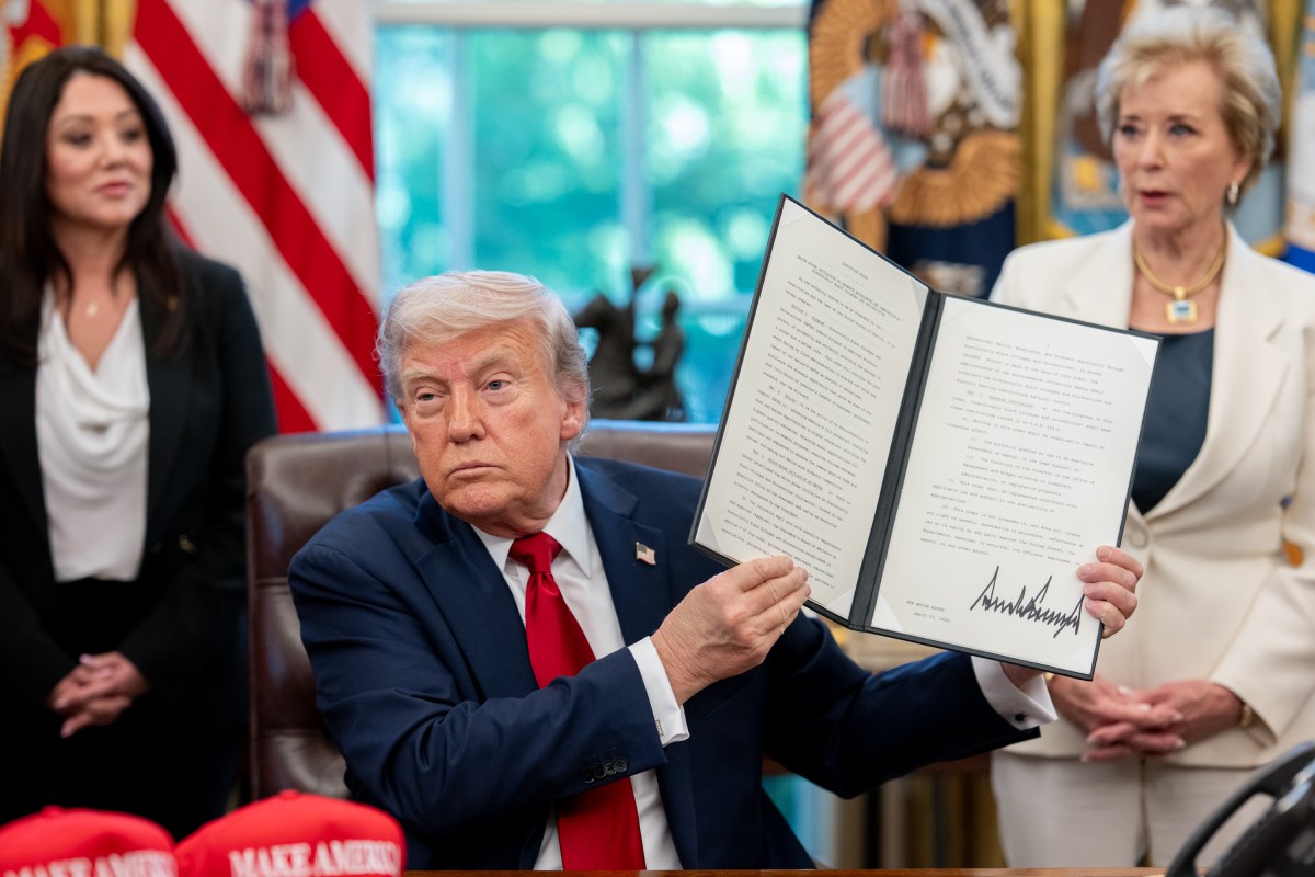 President Donald Trump signs executive orders alongside Secretary of Education Linda McMahon and wounded warriors in the Oval Office, Wednesday, April 23, 2025. (Official White House Photo by Molly Riley)
