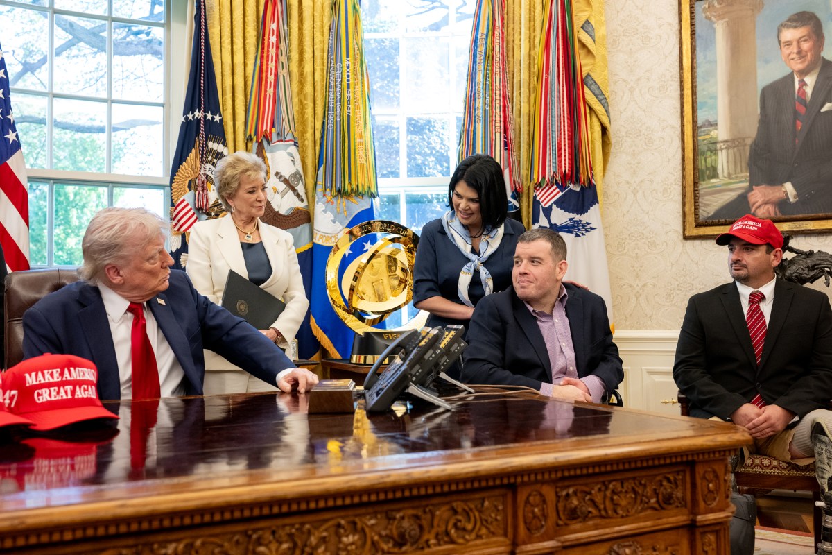 President Donald Trump signs executive orders alongside Secretary of Education Linda McMahon and wounded warriors in the Oval Office, Wednesday, April 23, 2025. (Official White House Photo by Molly Riley)