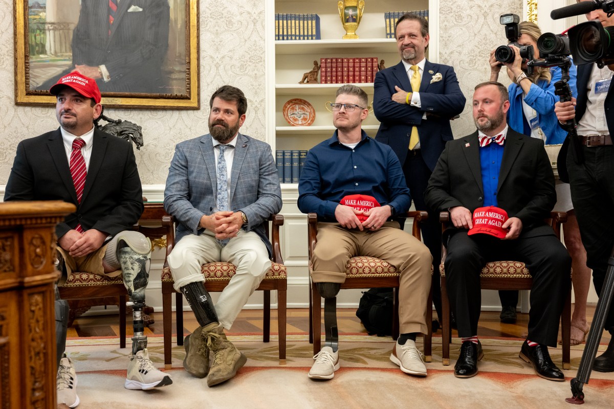 President Donald Trump signs executive orders alongside Secretary of Education Linda McMahon and wounded warriors in the Oval Office, Wednesday, April 23, 2025. (Official White House Photo by Molly Riley)