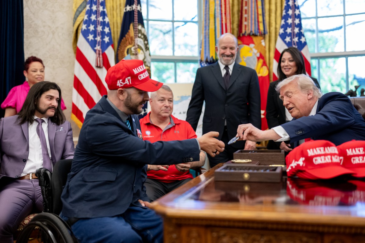 President Donald Trump signs executive orders alongside Secretary of Education Linda McMahon and wounded warriors in the Oval Office, Wednesday, April 23, 2025. (Official White House Photo by Molly Riley)