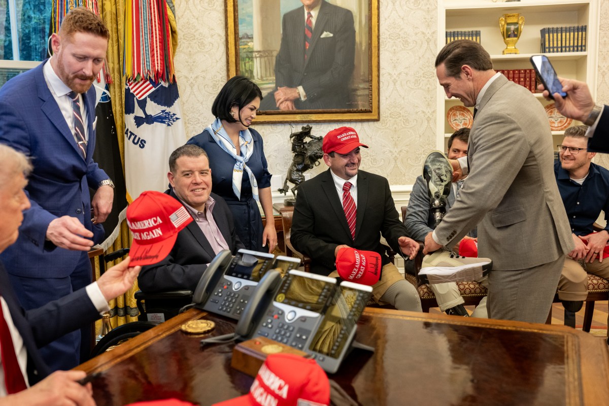 President Donald Trump signs executive orders alongside Secretary of Education Linda McMahon and wounded warriors in the Oval Office, Wednesday, April 23, 2025. (Official White House Photo by Molly Riley)