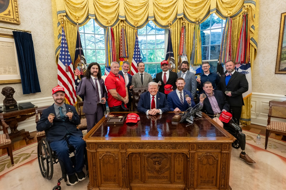 President Donald Trump signs executive orders alongside Secretary of Education Linda McMahon and wounded warriors in the Oval Office, Wednesday, April 23, 2025. (Official White House Photo by Molly Riley)