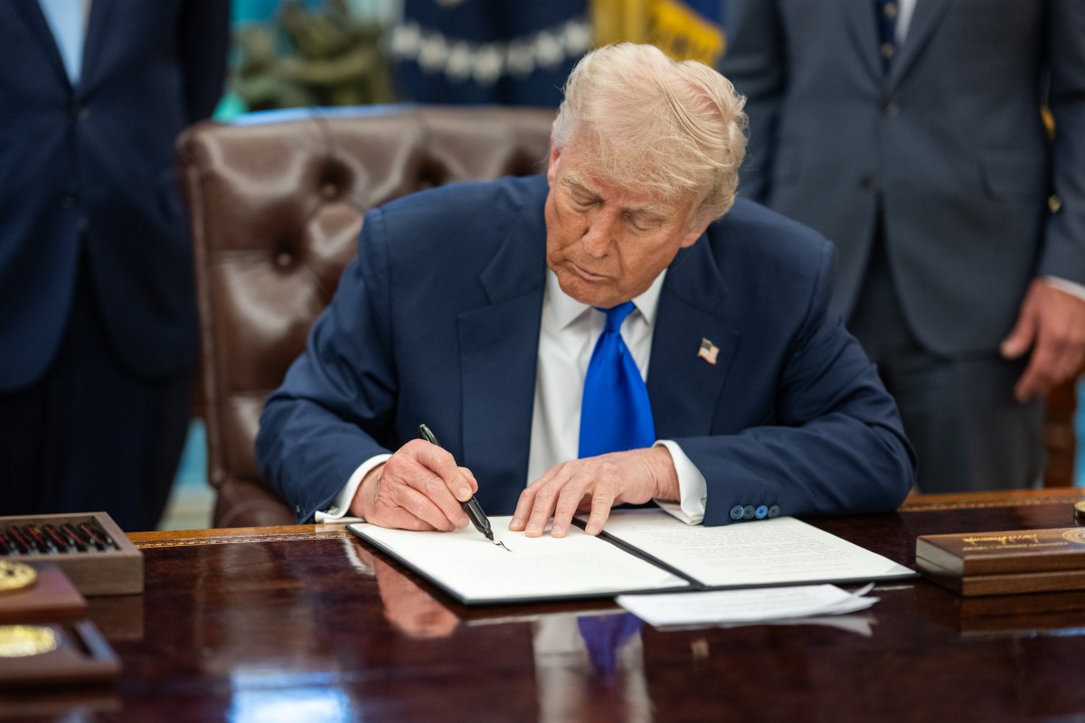President Donald Trump signs executive orders flanked by Secretary of Health and Human Services Robert F. Kennedy, Jr. and Director of the National Institutes of Health Jay Bhattacharya, Monday, May 5, 2025, in the Oval Office. (Official White House Photo by Molly Riley)