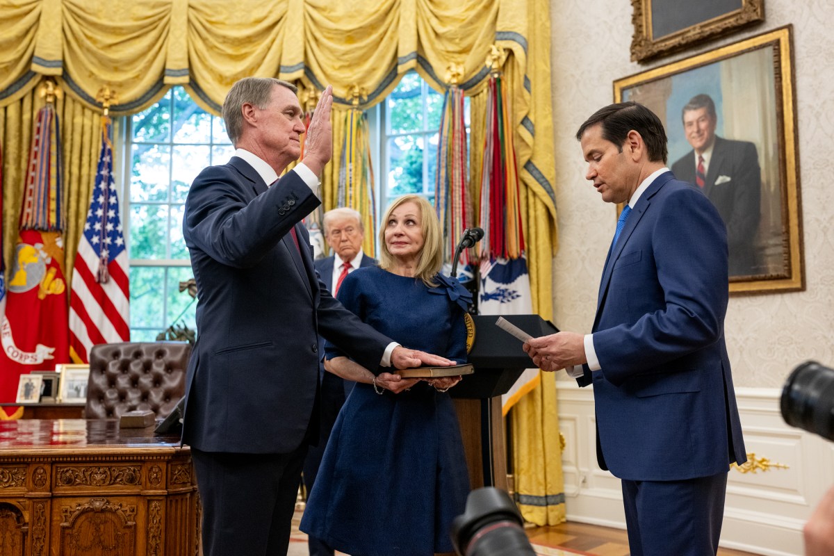 The U.S. Ambassador to China David Purdue is sworn in by Secretary of State Marco Rubio, Wednesday, May 7, 2025, in the Oval Office. (Official White House Photo by Molly Riley)