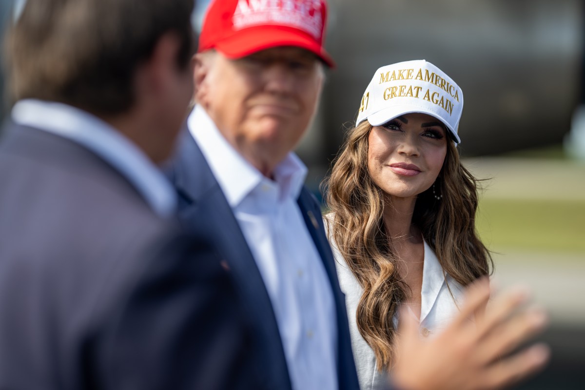 Secretary of Homeland Security Kristi Noem looks on as President Donald Trump greets Florida Governor Ron DeSantis (R) at Dade-Collier Training and Transition Airport in Ochopee, Florida, Tuesday, July 1, 2025. (Official White House Photo by Daniel Torok)