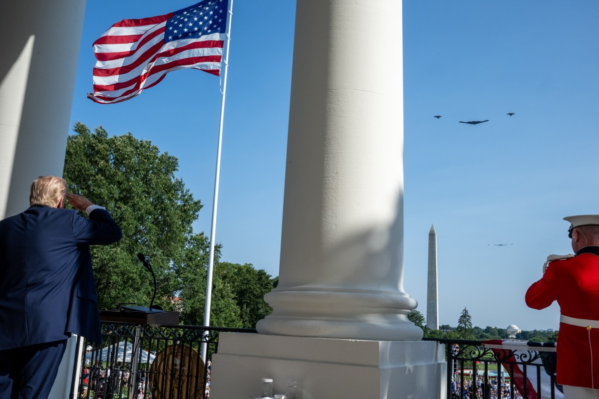 President Donald Trump and First Lady Melania Trump watch a flyover by a B-2 Spirit Bomber from Whiteman Air Force Base and two F-35 fighters, in honor of Military Personnel who participated in Operation Midnight, before signing the One Big Beautiful Bill Act on the South Lawn of the White House, Friday, July 4, 2025, during the 4th of July picnic. (Official White House Photo by Daniel Torok)