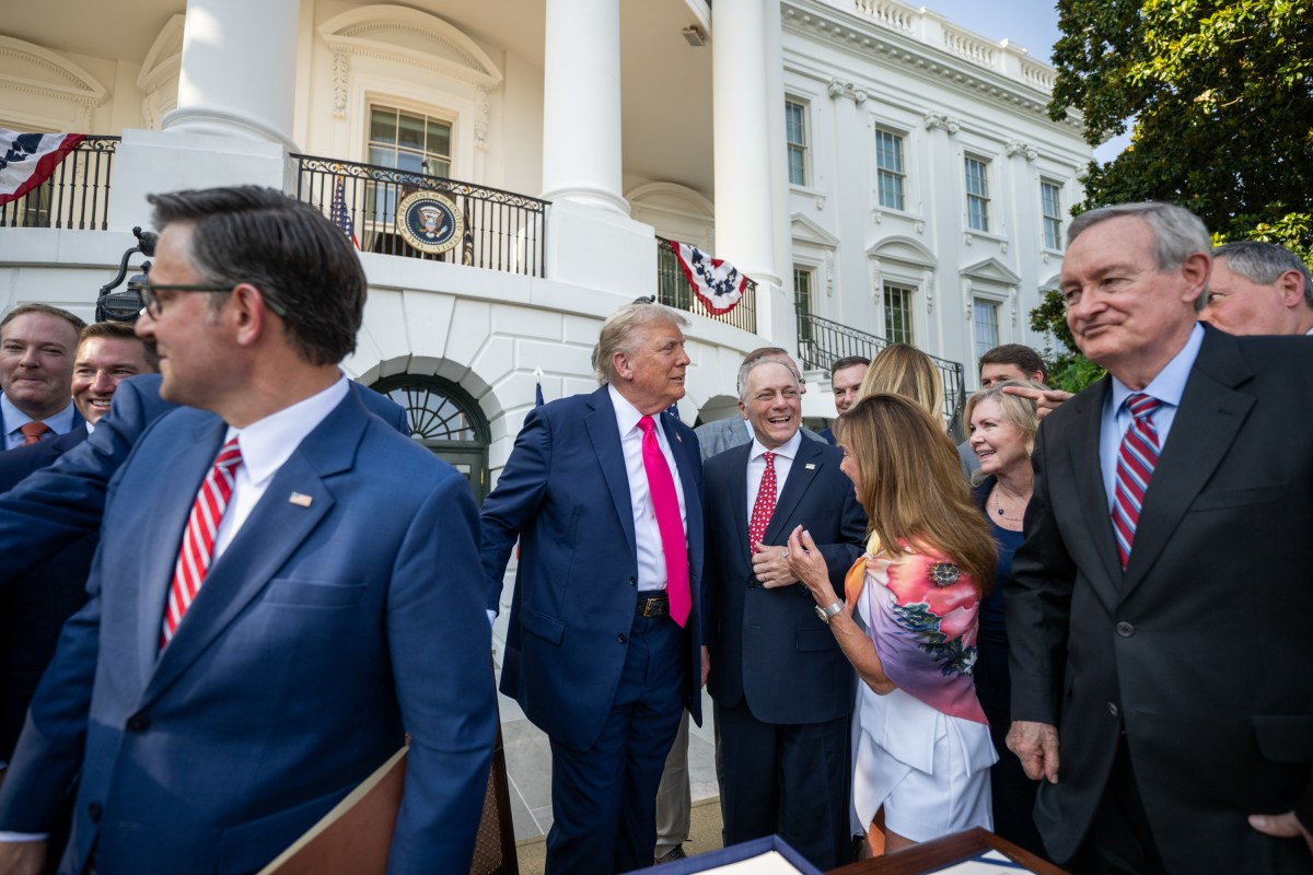 President Donald Trump speaks with Cabinet members and  others before signing the One Big Beautiful Bill Act on the South Lawn of the White House, Friday, July 4, 2025, during the 4th of July picnic. (Official White House Photo by Daniel Torok)