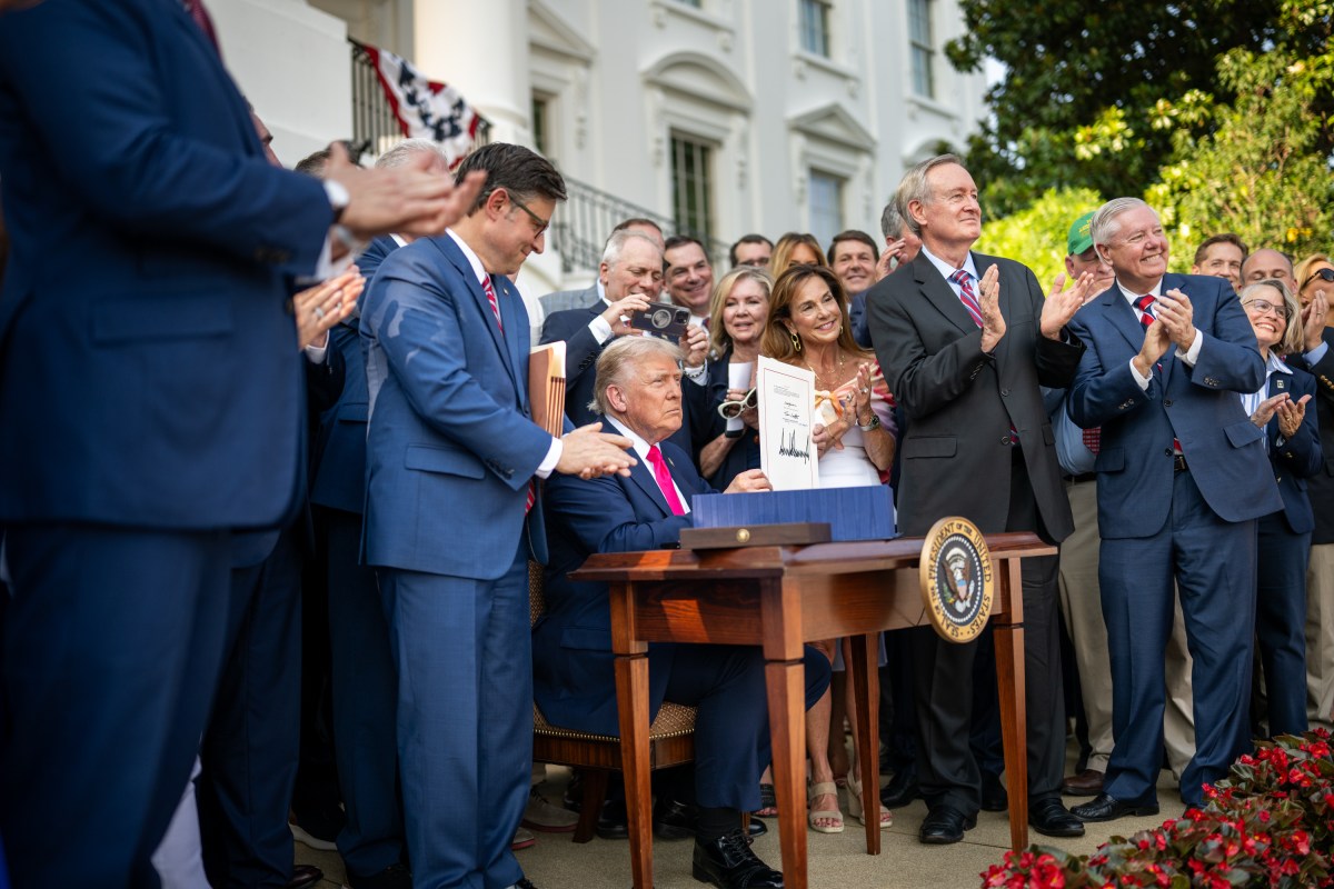 President Donald Trump signs the One Big Beautiful Bill Act on the South Lawn of the White House, Friday, July 4, 2025, during the 4th of July picnic. (Official White House Photo by Daniel Torok)