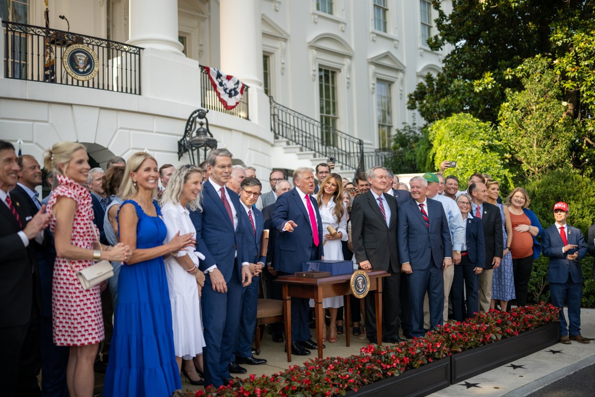 President Donald Trump speaks with Cabinet members and others after signing the One Big Beautiful Bill Act on the South Lawn of the White House, Friday, July 4, 2025, during the 4th of July picnic. (Official White House Photo by Daniel Torok)
