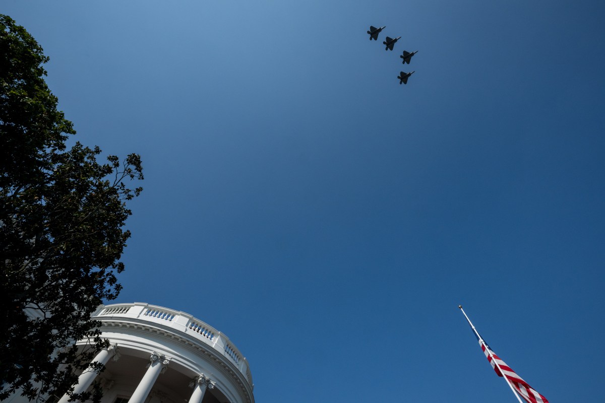 President Donald Trump and First Lady Melania Trump watch a B-2 Spirit Bomber flyover in honor of military personnel who participated in Operation Midnight, before signing the One Big Beautiful Bill Act on the South Lawn of the White House, Friday, July 4, 2025, during the 4th of July picnic. (Official White House Photo by Molly Riley)