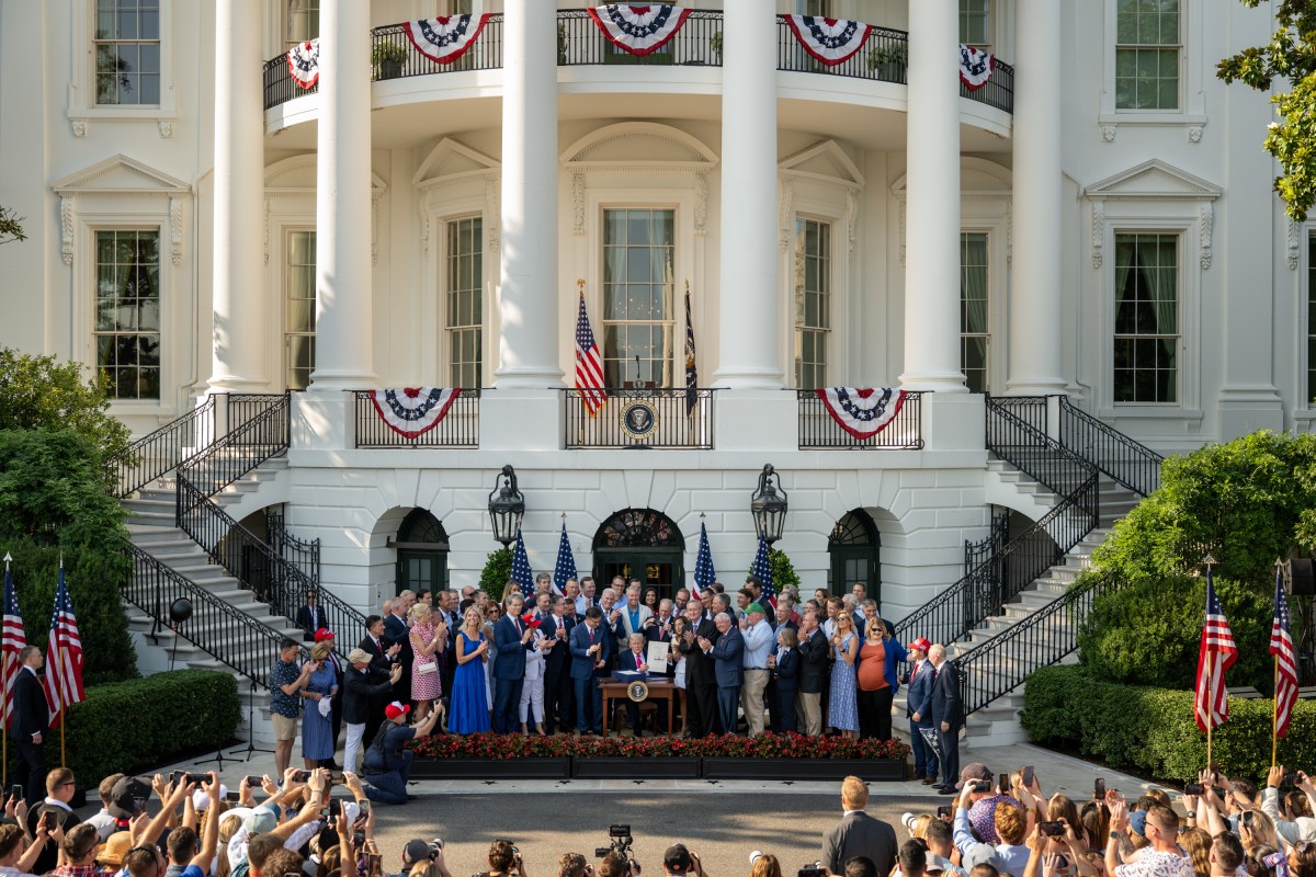 President Donald Trump signs the One Big Beautiful Bill Act on the South Lawn of the White House, Friday, July 4, 2025, during the 4th of July picnic. (Official White House Photo by Molly Riley)