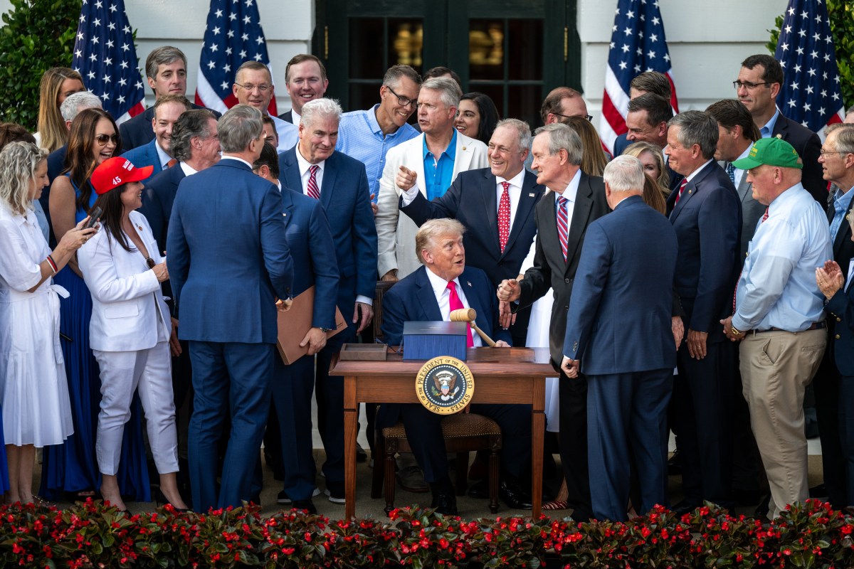 President Donald Trump speaks with Cabinet members and others after signing the One Big Beautiful Bill Act on the South Lawn of the White House, Friday, July 4, 2025, during the 4th of July picnic. (Official White House Photo by Molly Riley)
