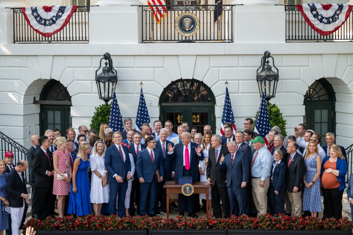 President Donald Trump speaks with Cabinet members and others after signing the One Big Beautiful Bill Act on the South Lawn of the White House, Friday, July 4, 2025, during the 4th of July picnic. (Official White House Photo by Molly Riley)