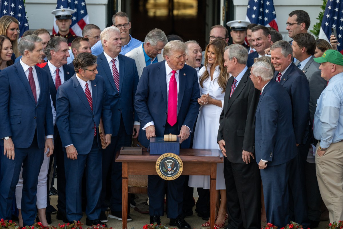 President Donald Trump speaks with Cabinet members and others after signing the One Big Beautiful Bill Act on the South Lawn of the White House, Friday, July 4, 2025, during the 4th of July picnic. (Official White House Photo by Molly Riley)