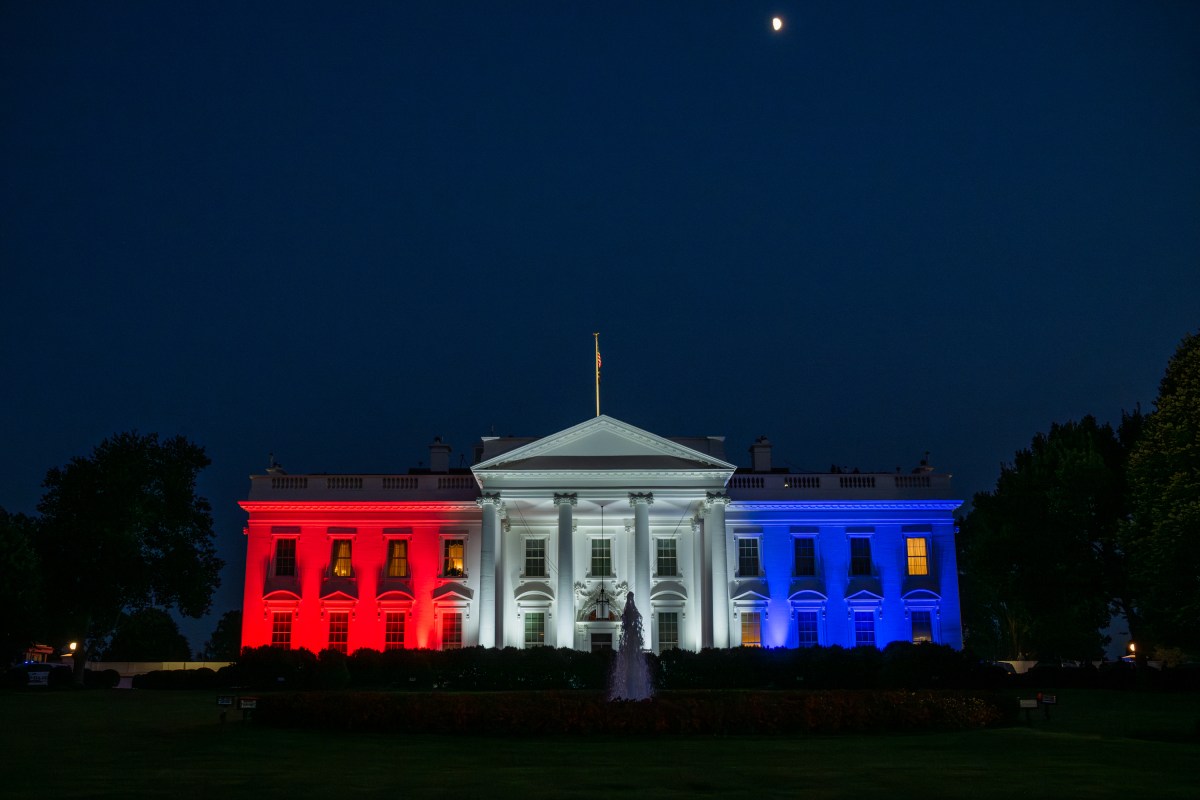 The White House, lit with red, white, and blue lights, Friday, July 4, 2025, for the 4th of July picnic. (Official White House Photo by Patrick Witty)