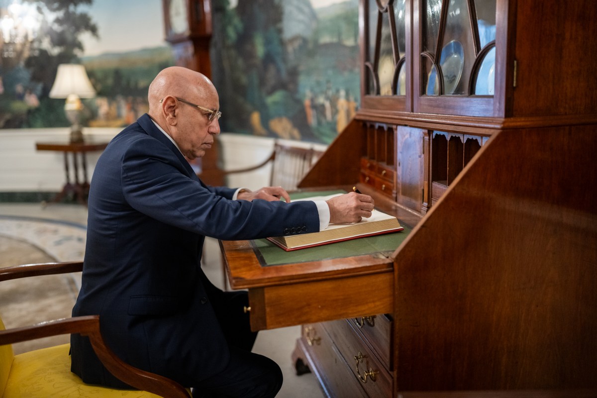 President Mohamed Ould Cheikh El Ghazouani of Mauritania signs the guest book in the Diplomatic Reception Room of the White House, Wednesday, July 9, 2025, before attending a multilateral luncheon with President Donald Trump and other African leaders. (Official White House Photo by Molly Riley)