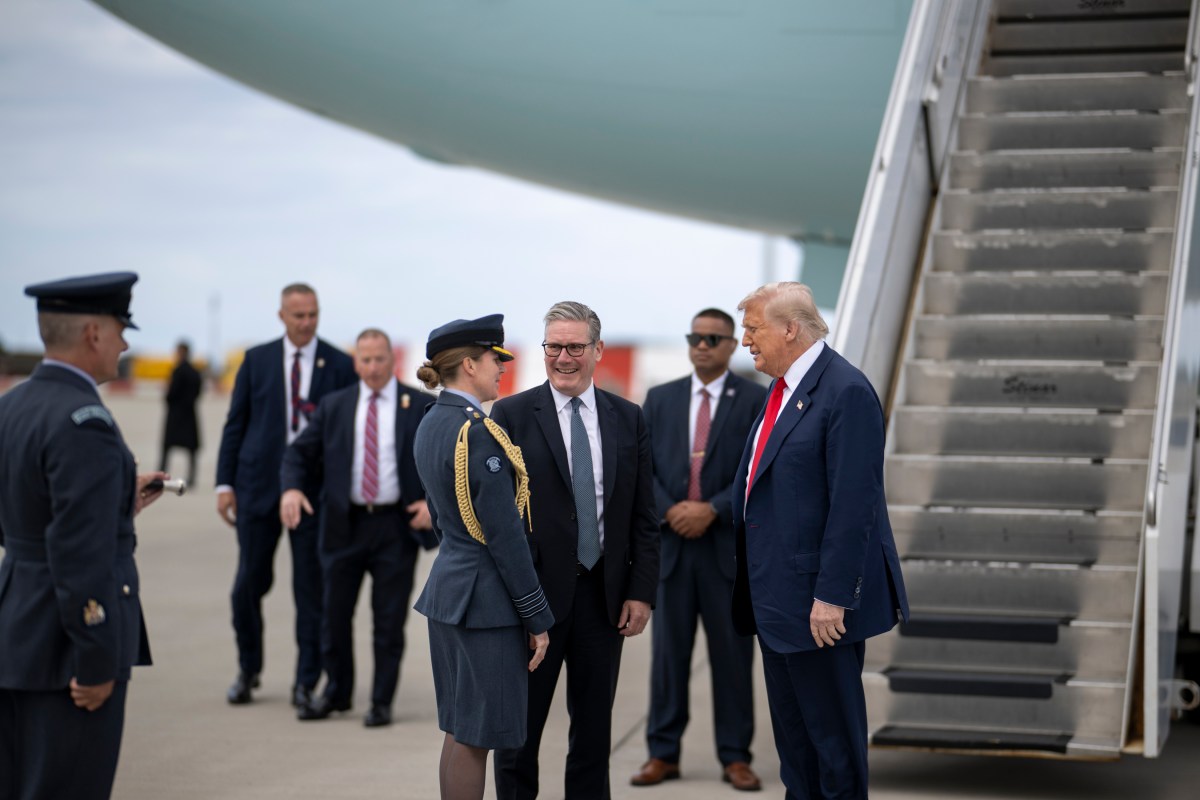 President Donald Trump, with U.K. Prime Minister Keir Starmer, is greeted by Wing Commander Captain Sarah Brewin and Warrant Officer Joe Mulholland at Royal Air Force Lossiemouth, Scotland on Monday, July 28, 2025. (Official White House Photo by Daniel Torok)