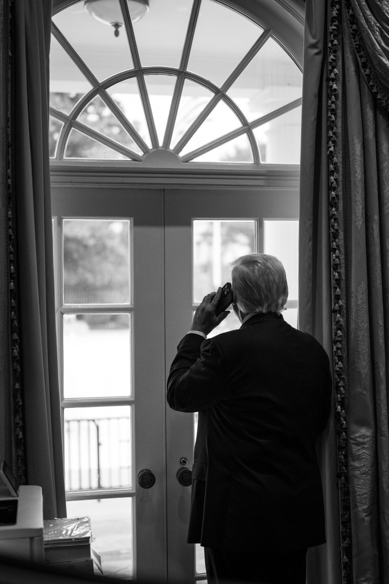 President Donald Trump makes a phone call, Thursday, July 31, 2025, in the Outer Oval of the White House. (Official White House Photo by Daniel Torok)