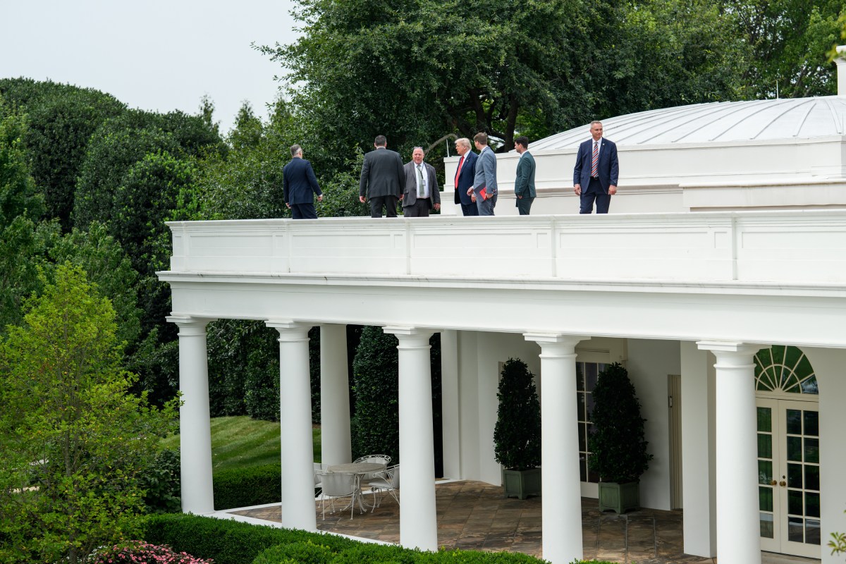 President Donald Trump speaks with Director of Facilities Todd Robinson, architect James McCrery, and others on the roof of the Oval Office of the White House, Tuesday, August 5, 2025. (Official White House Photo by Molly Riley)