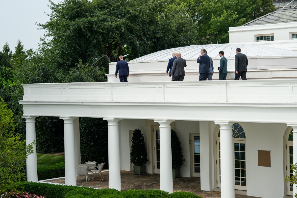 President Donald Trump speaks with Director of Facilities Todd Robinson, architect James McCrery, and others on the roof of the Oval Office of the White House, Tuesday, August 5, 2025. (Official White House Photo by Molly Riley)