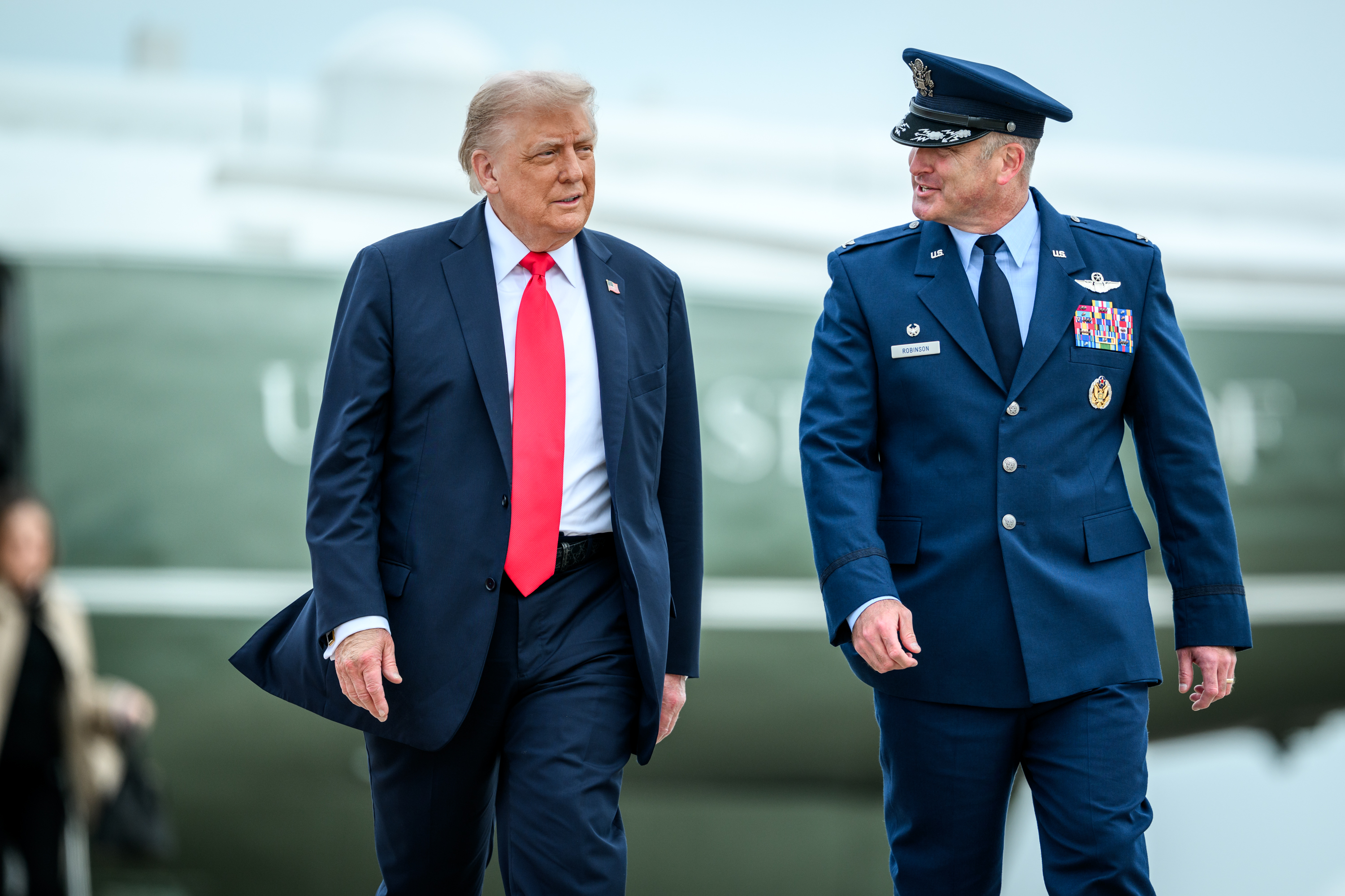 President Donald Trump speaks to the press before boarding Marine