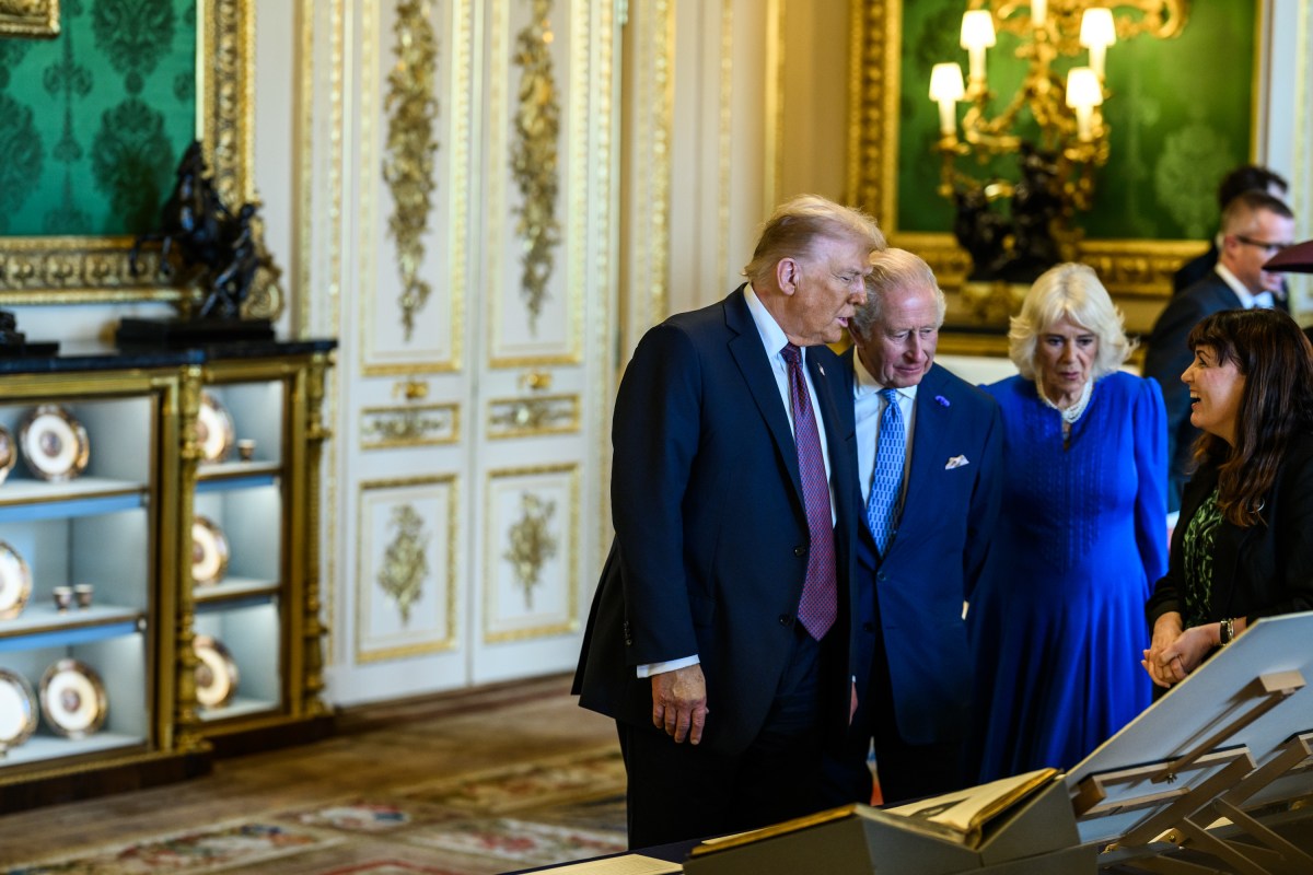 President Donald Trump and First Lady Melania Trump view a collection of American-related items from the royal collection with King Charles III and Queen Camilla in the Green Drawing Room at Windsor Castle in Windsor, England on Wednesday, September 17, 2025. (Official White House Photo by Daniel Torok)