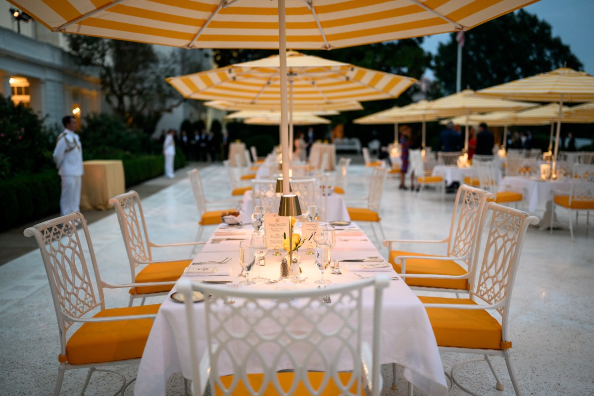 President Donald Trump speaks with Cabinet secretaries and White House staff on the West Colonnade before a dinner in the Rose Garden, Wednesday, September 24, 2025. (Official White House Photo by Molly Riley)