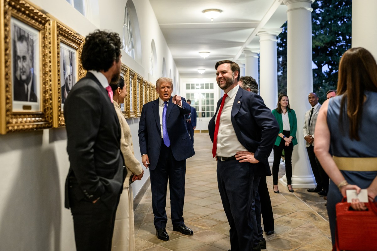 President Donald Trump speaks with Cabinet secretaries and White House staff on the West Colonnade before a dinner in the Rose Garden, Wednesday, September 24, 2025. (Official White House Photo by Molly Riley)