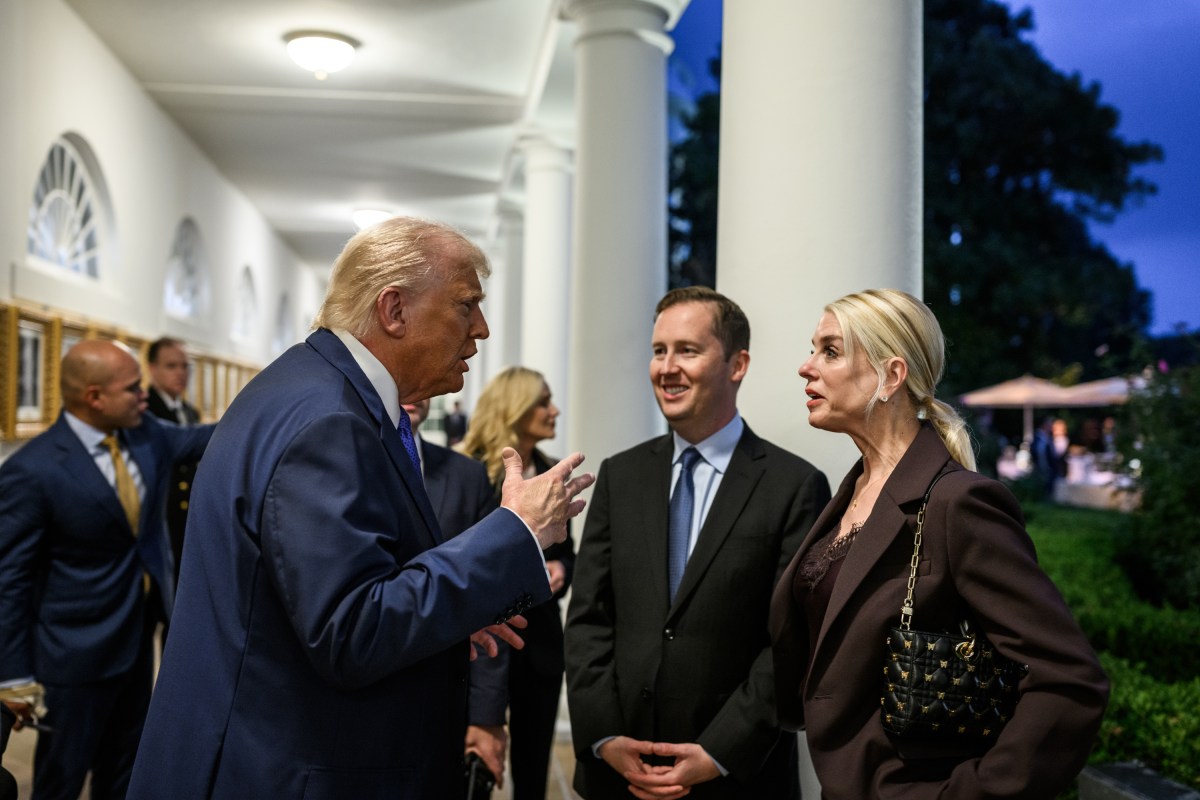 President Donald Trump speaks with Cabinet secretaries and White House staff on the West Colonnade before a dinner in the Rose Garden, Wednesday, September 24, 2025. (Official White House Photo by Molly Riley)