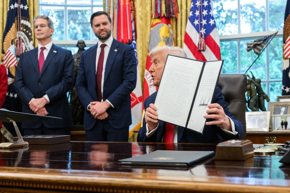 President Donald Trump holds a signed executive order allowing a U.S. deal for TikTok, Thursday, September 25, 2025, in the Oval Office. (Official White House Photo by Joyce N. Boghosian)