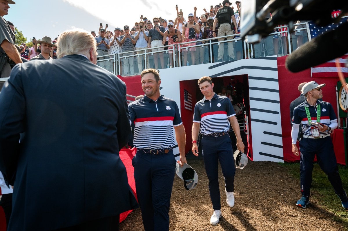 President Donald Trump greets Team U.S. players Bryson DeChambeau and Ben Griffin at the first hole of the Ryder Cup Tournament at Bethpage Black Course, Friday, September 26, 2025, in Farmingdale, New York. (Official White House Photo by Joyce N. Boghosian)