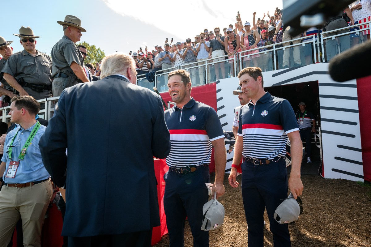 President Donald Trump greets Team U.S. players Bryson DeChambeau and Ben Griffin at the first hole of the Ryder Cup Tournament at Bethpage Black Course, Friday, September 26, 2025, in Farmingdale, New York. (Official White House Photo by Joyce N. Boghosian)