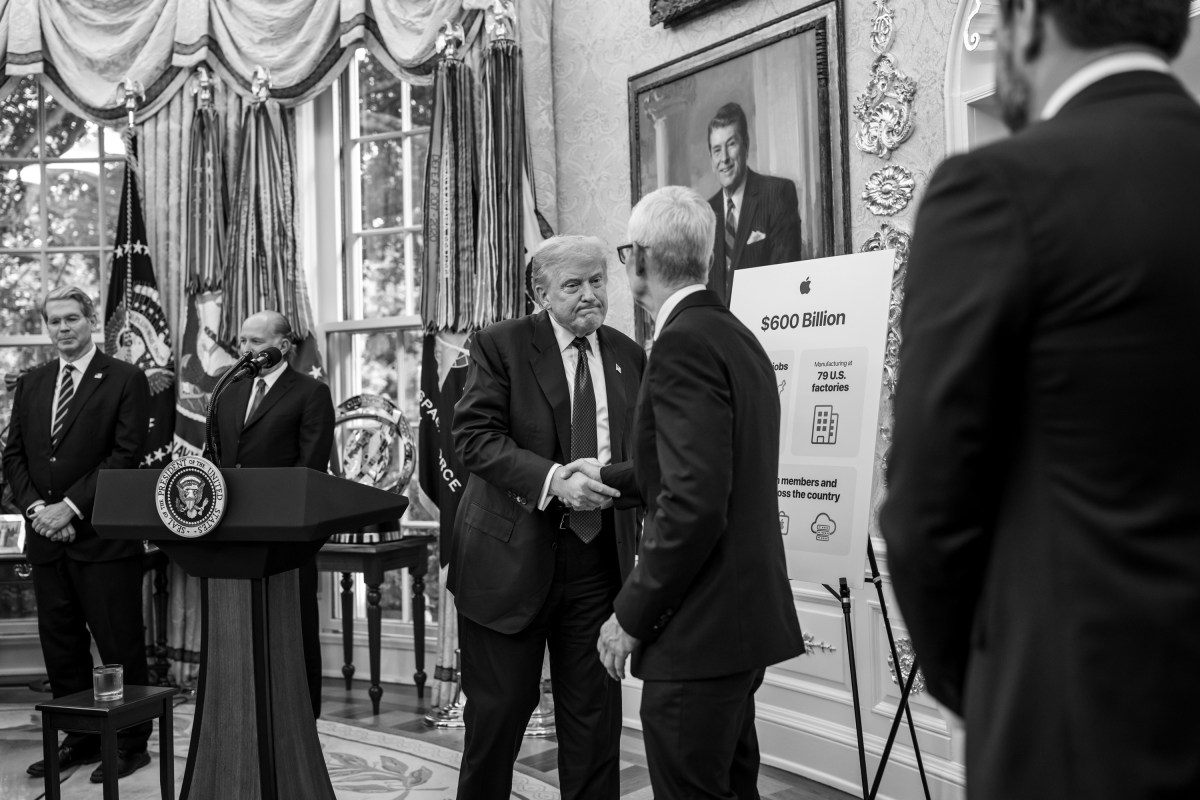 President Donald Trump shakes hands with Apple CEO Tim Cook after announcing a $100 billion investment in the U.S., Wednesday, August 6, 2025, in the Oval Office. (Official White House Photo by Molly Riley)