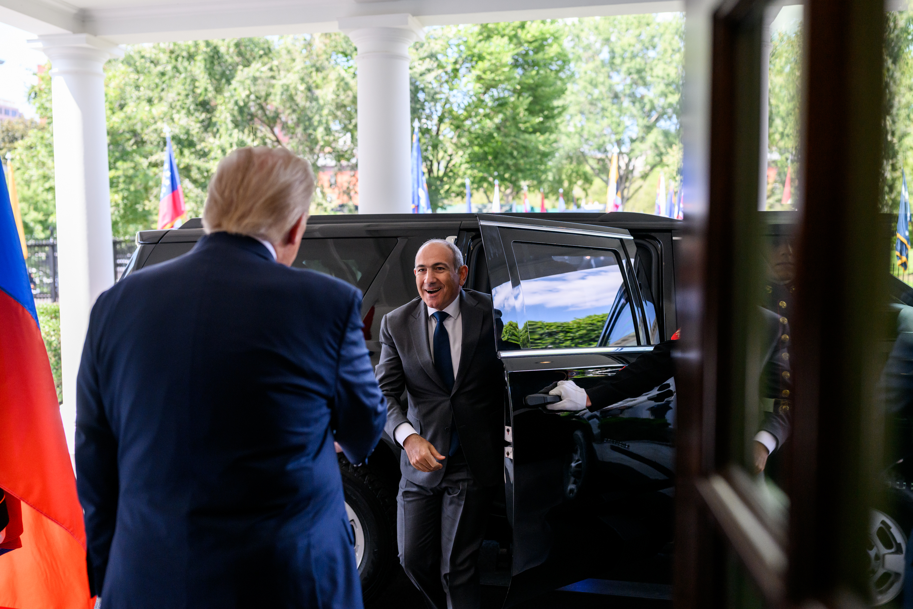 President Donald Trump signs a trilateral joint declaration with