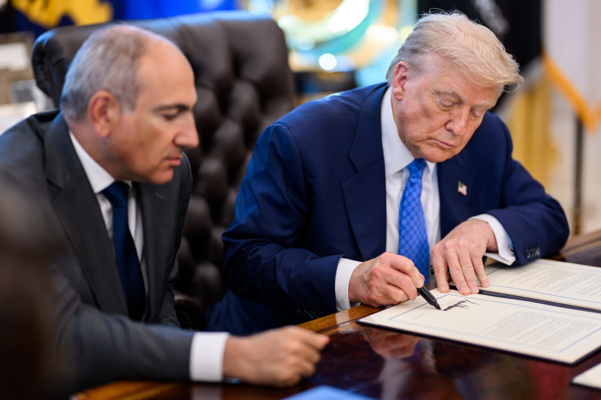 President Donald Trump signs a document alongside Prime Minister Nikol Pashinyan of Armenia in the Oval Office, Friday, August 8, 2025. (Official White House Photo by Daniel Torok)
