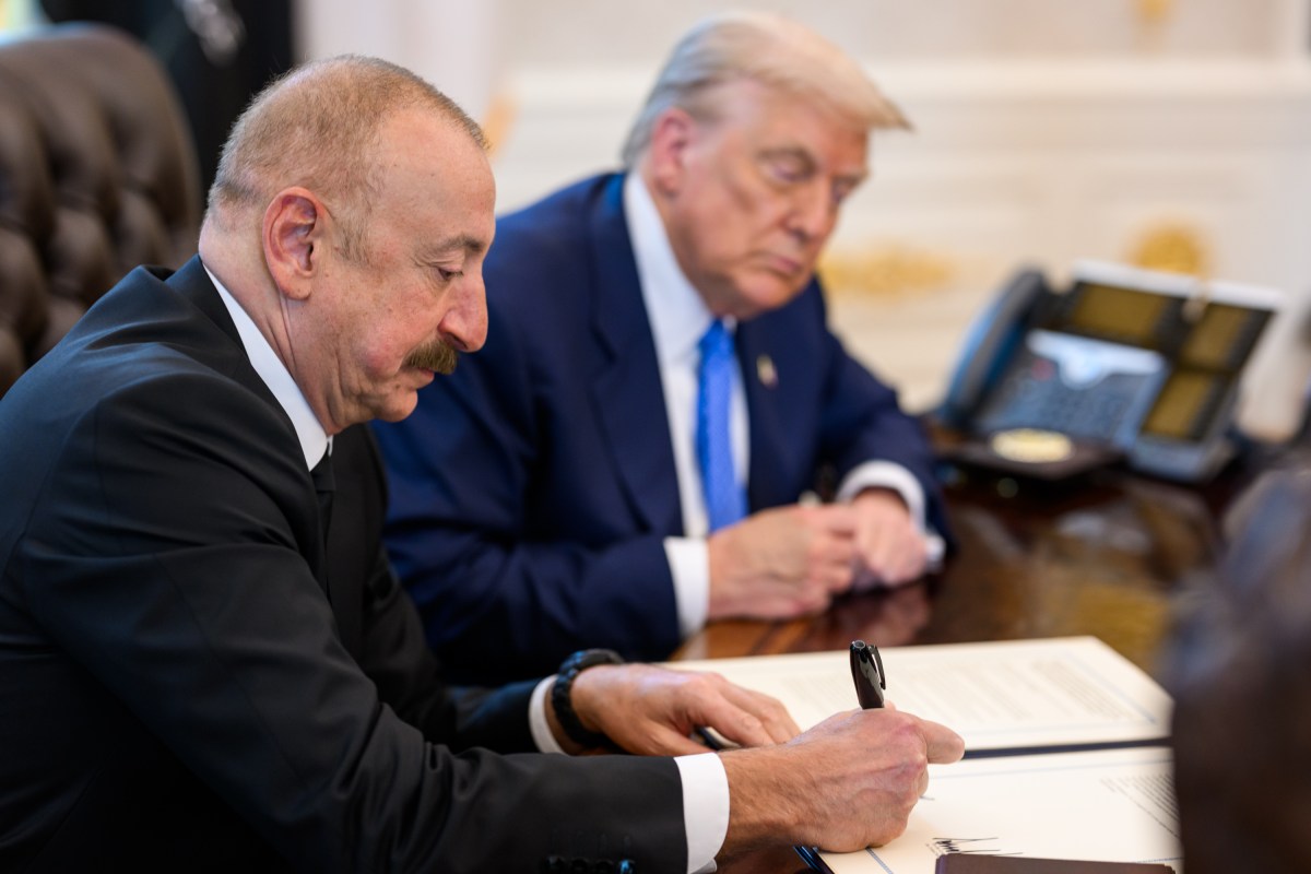 President Donald Trump signs a document alongside President Ilham Aliyev of Azerbaijan in the Oval Office, Friday, August 8, 2025. (Official White House Photo by Daniel Torok)