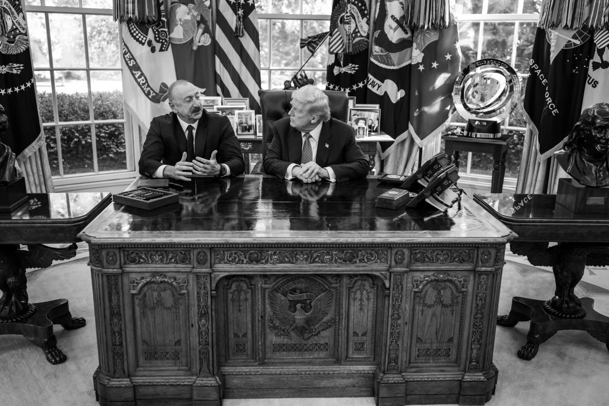 President Donald Trump signs a document alongside President Ilham Aliyev of Azerbaijan in the Oval Office, Friday, August 8, 2025. (Official White House Photo by Daniel Torok)