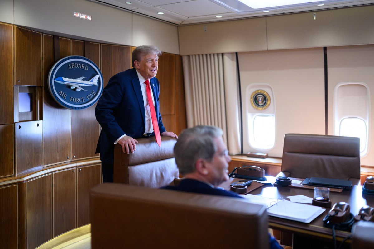 President Donald Trump speaks with staff on board Air Force One, Friday, August 15, 2025, en route to Joint Base Elmendorf Richardson, Alaska for a meeting with Russian president Vladimir Putin. (Official White House Photo by Daniel Torok)