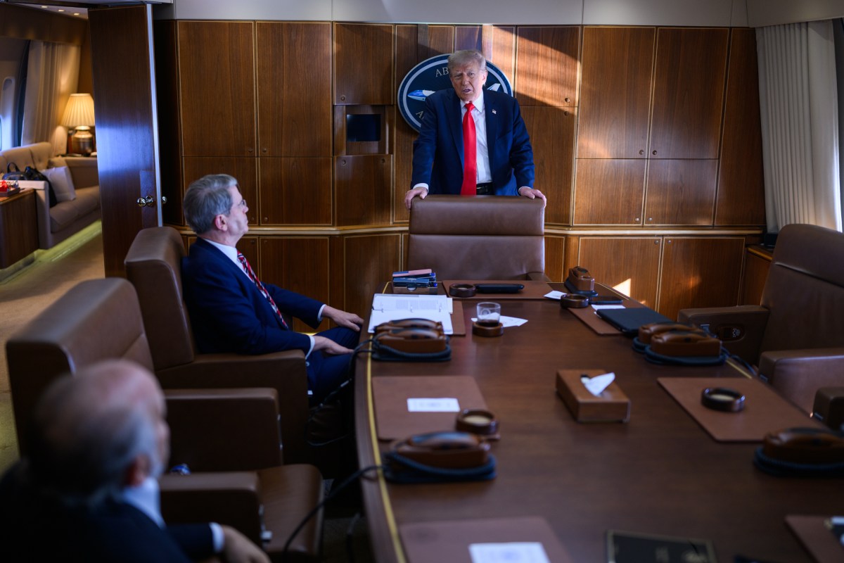 President Donald Trump speaks with staff on board Air Force One, Friday, August 15, 2025, en route to Joint Base Elmendorf Richardson, Alaska for a meeting with Russian president Vladimir Putin. (Official White House Photo by Daniel Torok)