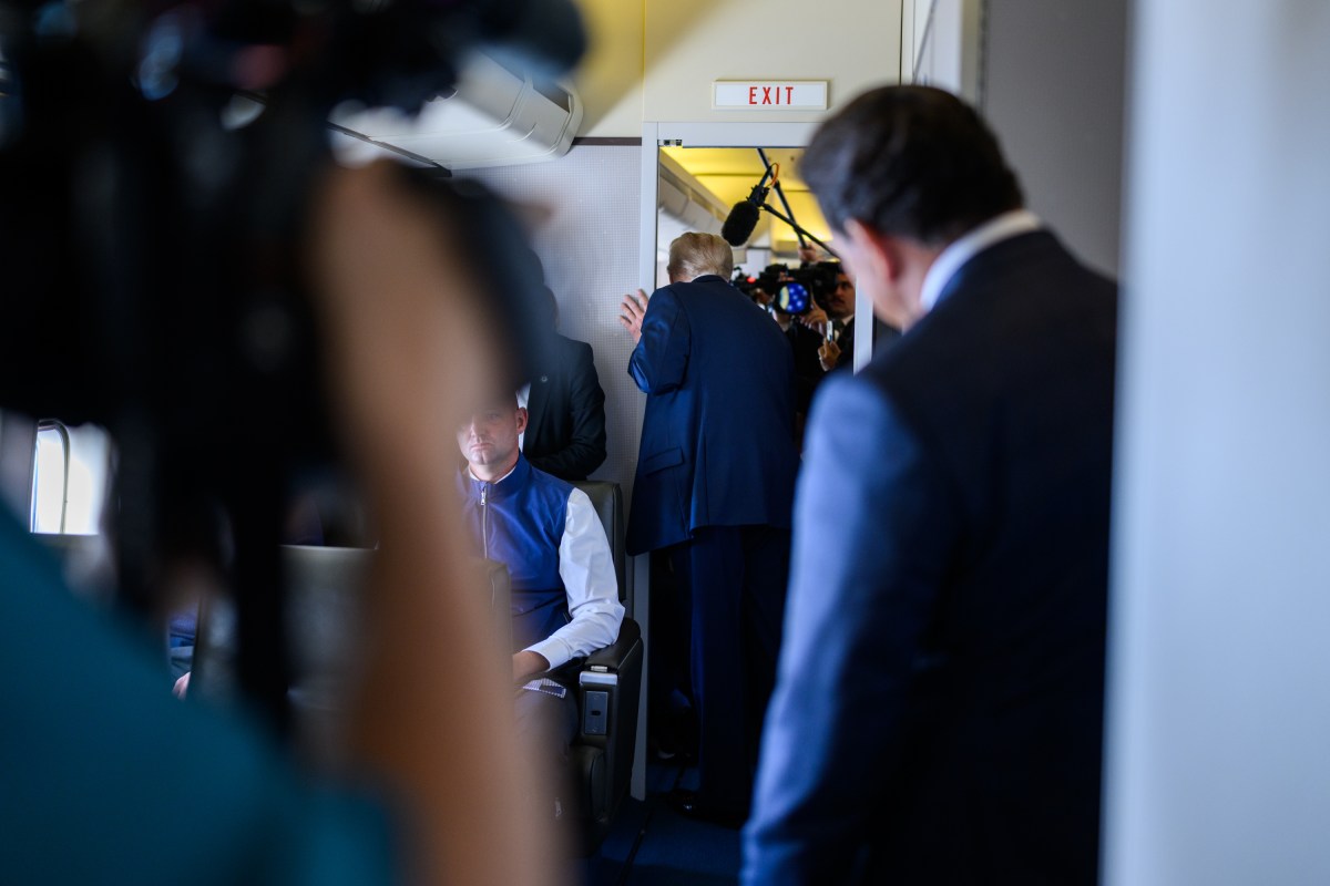 President Donald Trump speaks to members of the press on board Air Force One, Friday, August 15, 2025, en route to Joint Base Elmendorf Richardson, Alaska for a meeting with Russian president Vladimir Putin. (Official White House Photo by Daniel Torok)