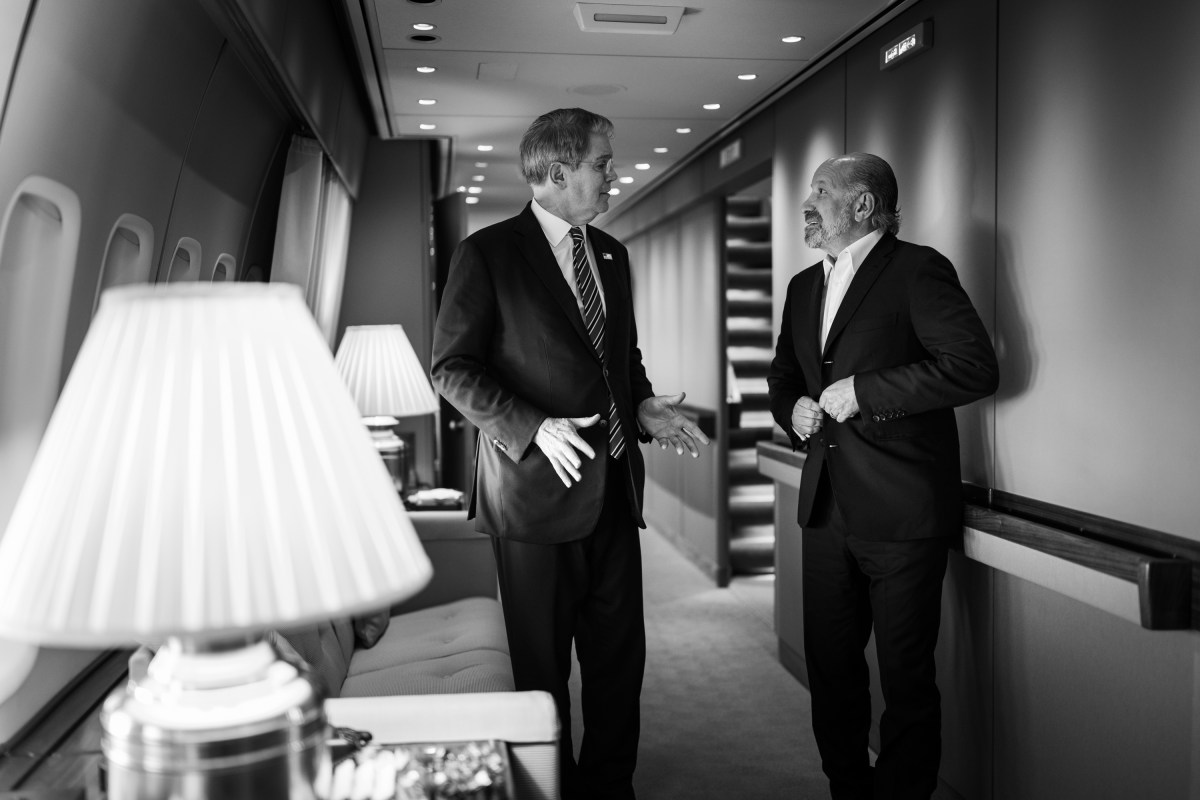 Secretary of the Treasury Scott Bessent and Secretary of Commerce Howard Lutnick speak on board Air Force One, Friday, August 15, 2025, en route to Joint Base Elmendorf Richardson, Alaska for a meeting between President Donald Trump and Russian president Vladimir Putin. (Official White House Photo by Daniel Torok)