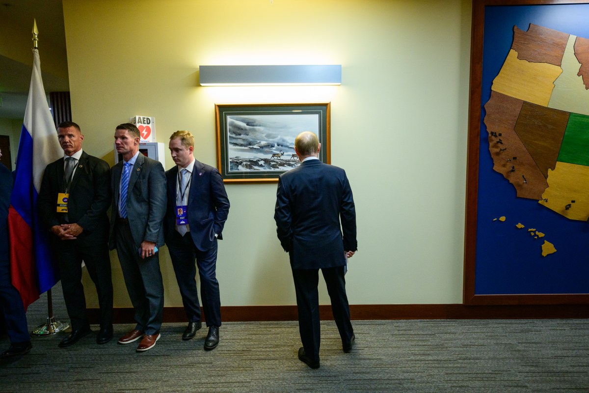 Russian president Vladimir Putin looks at a painting before attending the joint press conference with President Donald Trump at the Arctic Warrior Event Center at Joint Base Elmendorf Richardson in Anchorage, Alaska, Friday, August 15, 2025. (Official White House Photo by Daniel Torok)