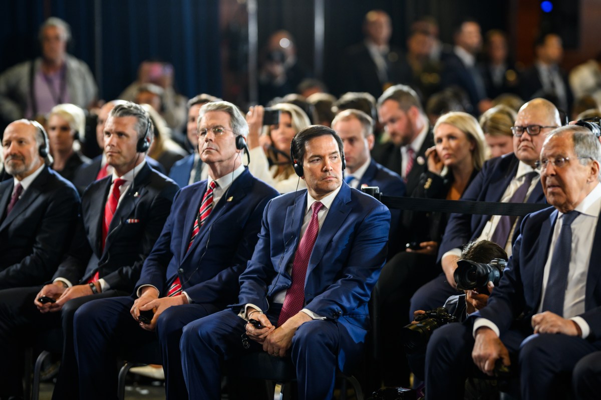 White House staff listen in as President Donald Trump and Russian president Vladimir Putin participate in a joint press conference after their meeting at the Arctic Warrior Event Center at Joint Base Elmendorf Richardson in Anchorage, Alaska, Friday, August 15, 2025. (Official White House Photo by Daniel Torok)