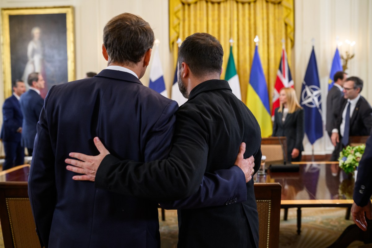 President Volodymyr Zelenskyy of Ukraine speaks with French President Emmanuel Macron during a multilateral meeting, Monday, August 18, 2025, in the East Room of the White House. (Official White House Photo by Daniel Torok)